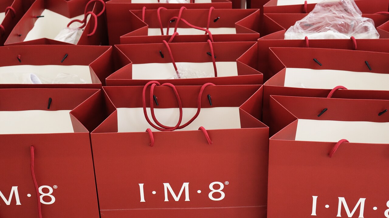 Rows of welcome bags laid out and ready for arriving guests